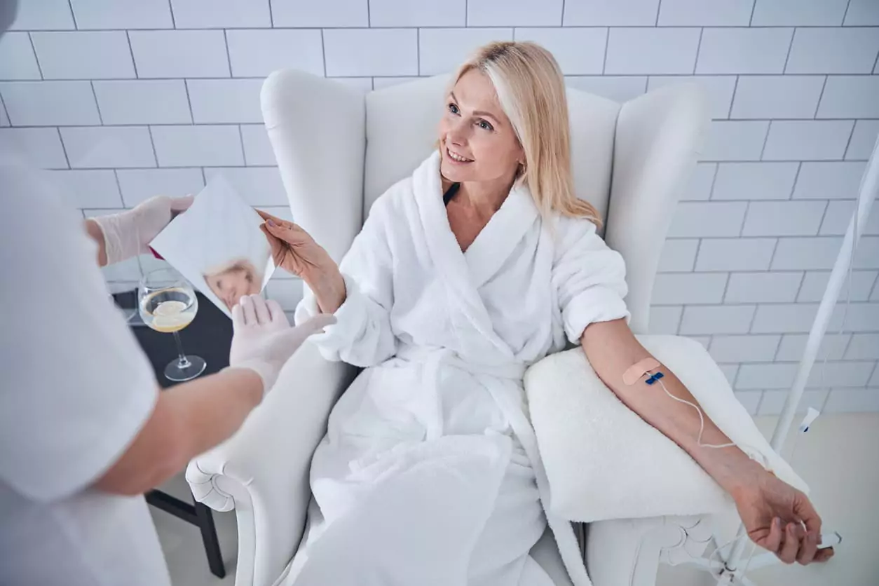 Woman White Plush Bathrobe Talking Doctor IV Therapy